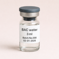 Glass vial labeled 'BAC water 3 ml' with a date on a beige background
