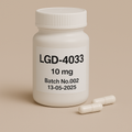 photograph of a white plastic pill bottle labeled "LGD-4033, 10 mg, Batch No.002, 13-05-2025." The bottle stands on a beige surface with two white capsules placed neatly in front. The minimalist beige background and bold black typography emphasize the clean, professional pharmaceutical design
